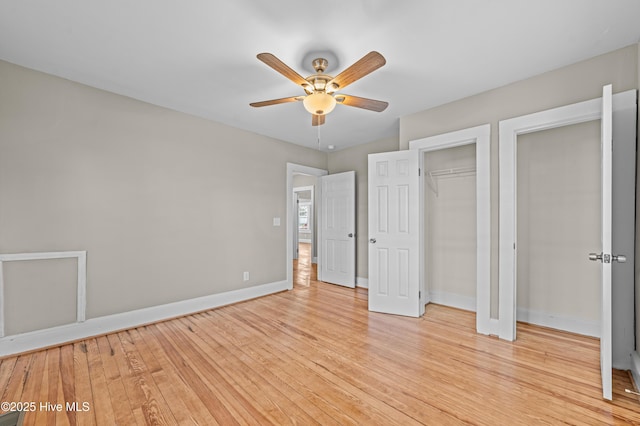 unfurnished bedroom featuring ceiling fan and light hardwood / wood-style flooring