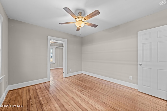 spare room featuring light hardwood / wood-style flooring and ceiling fan