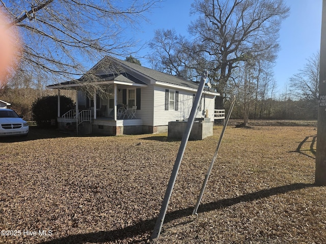 view of side of property featuring a porch