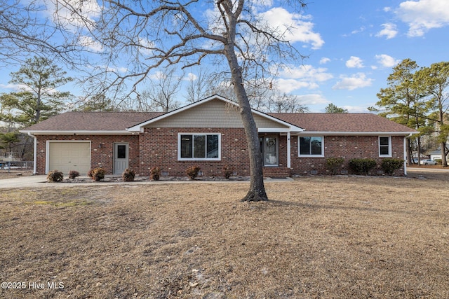 ranch-style home featuring a garage and a front lawn