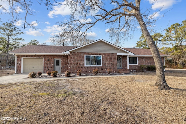 single story home with a garage and a front lawn