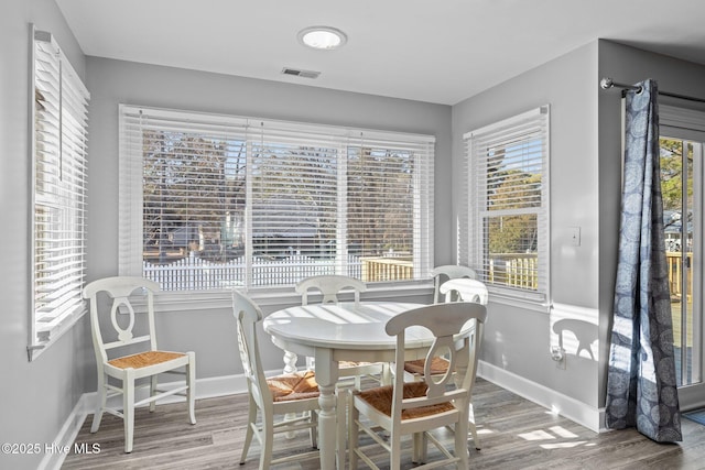 dining area featuring hardwood / wood-style flooring