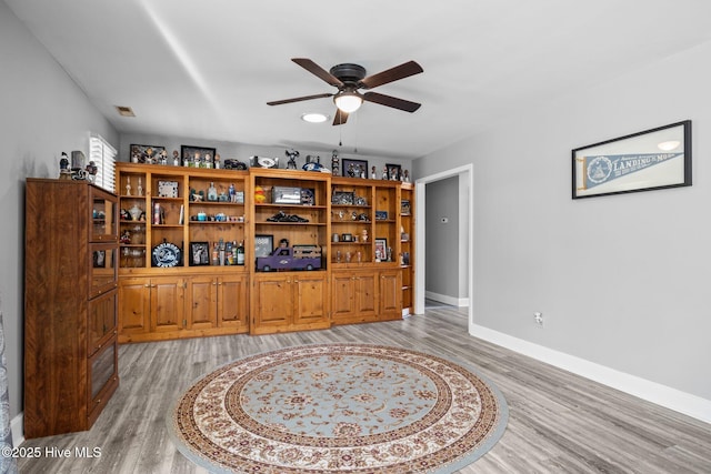 office featuring ceiling fan and light hardwood / wood-style flooring