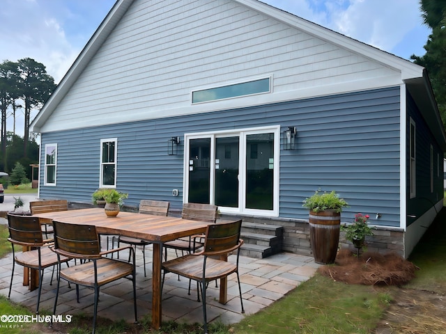 rear view of property with a patio area