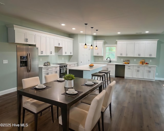 dining room featuring dark hardwood / wood-style floors and sink