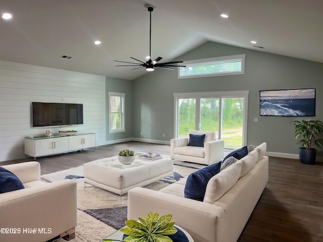 living room with ceiling fan, high vaulted ceiling, and wood-type flooring