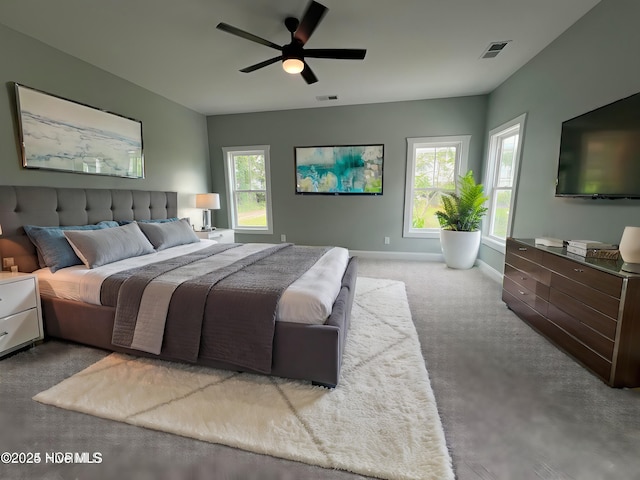 bedroom with ceiling fan and carpet floors