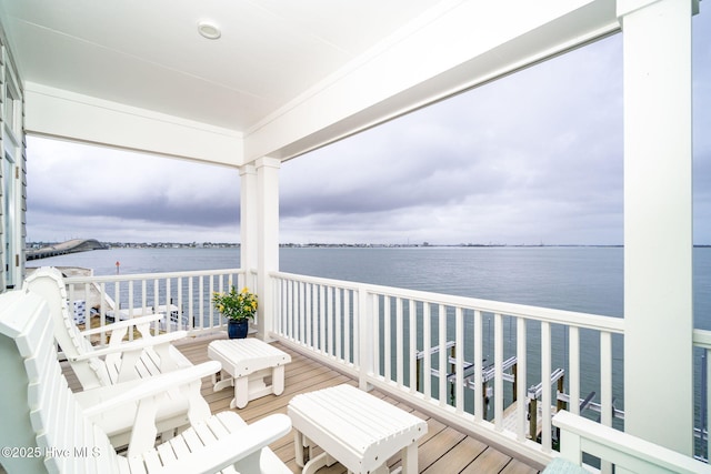 balcony featuring a water view