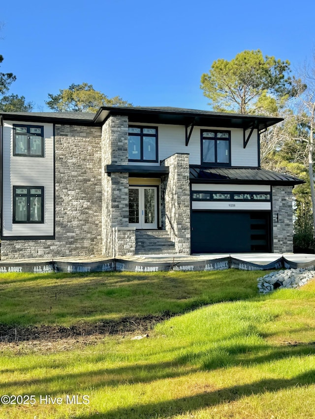 view of front of house with a garage and a front yard