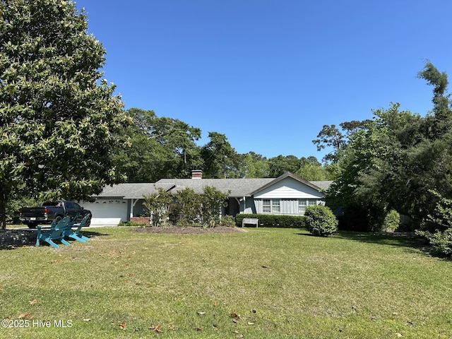 single story home with a front yard and a garage