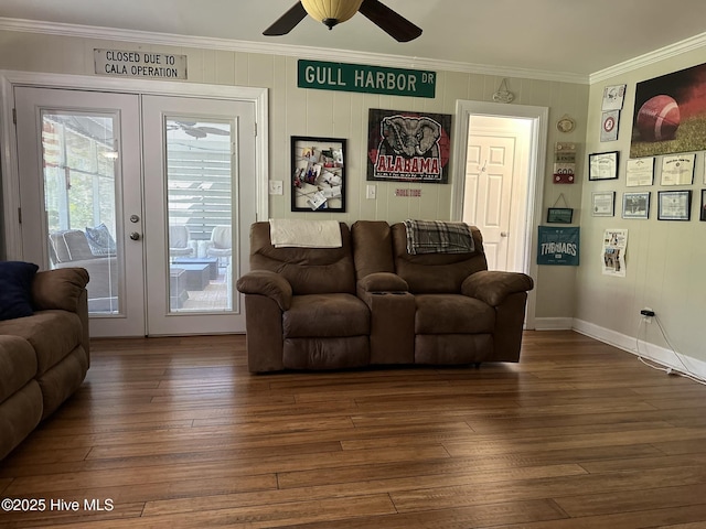 living room with ceiling fan, dark wood-type flooring, crown molding, and french doors