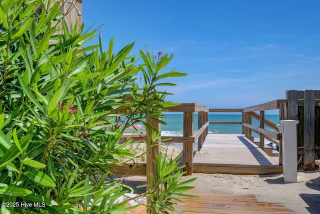 dock area with a beach view and a deck with water view