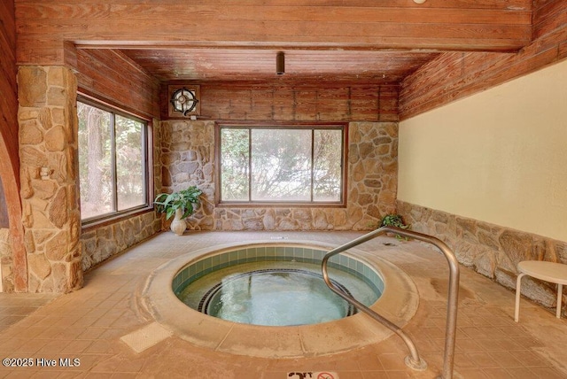 view of swimming pool with an indoor in ground hot tub