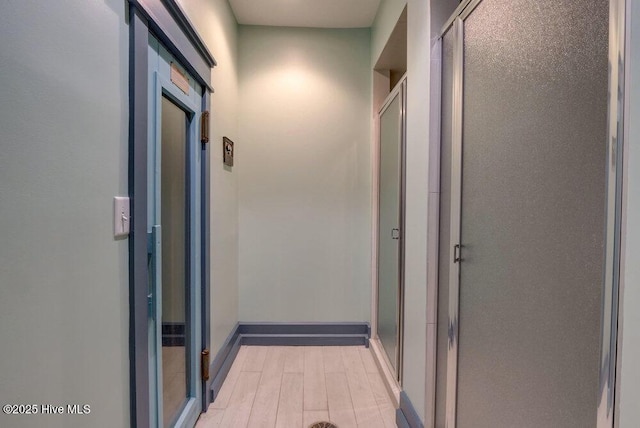 hallway featuring light hardwood / wood-style floors