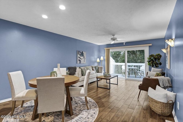 dining room featuring ceiling fan and hardwood / wood-style floors