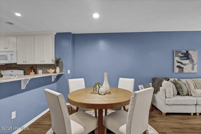 dining room featuring dark hardwood / wood-style floors