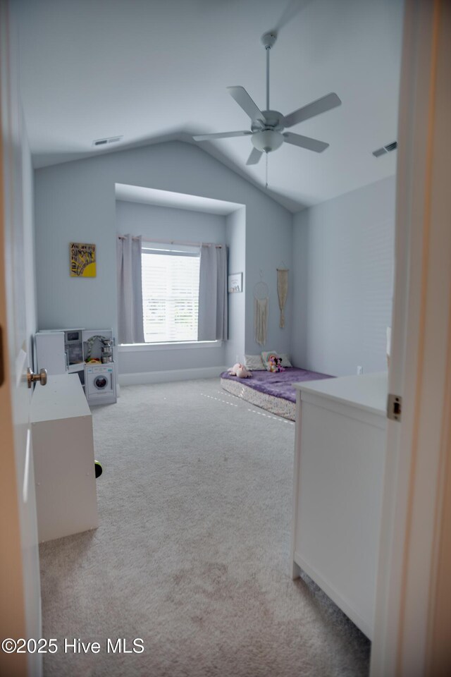 carpeted bedroom featuring ceiling fan and lofted ceiling