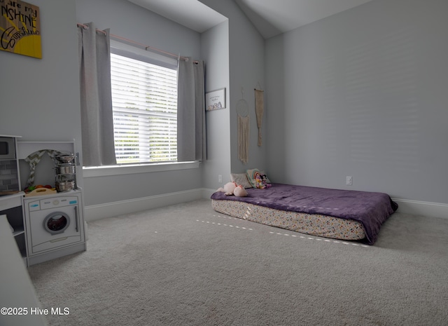 carpeted bedroom with vaulted ceiling and multiple windows