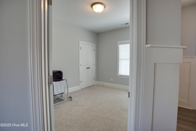 hall with carpet floors