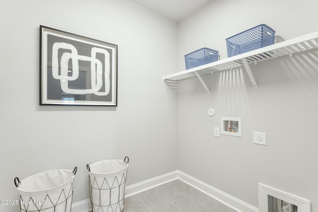 laundry area featuring washer hookup, baseboards, laundry area, tile patterned floors, and hookup for an electric dryer