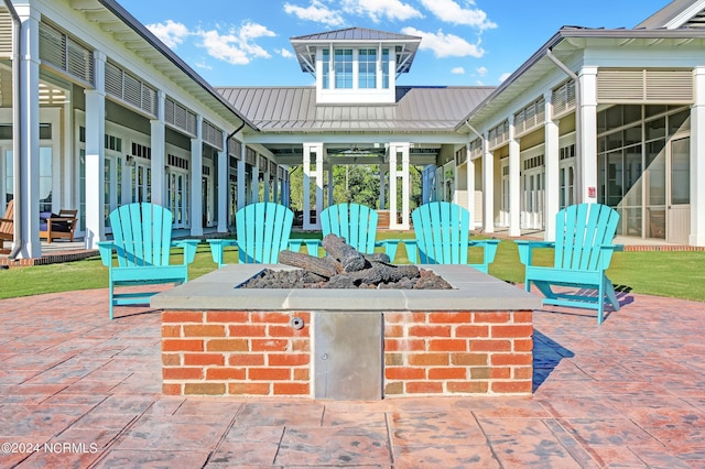 view of patio / terrace with an outdoor fire pit