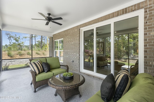 sunroom featuring an outdoor hangout area and a ceiling fan