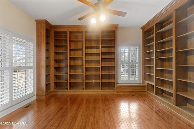 interior space with hardwood / wood-style flooring and ceiling fan