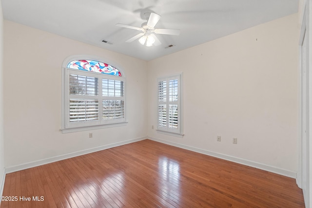 empty room with wood-type flooring and ceiling fan