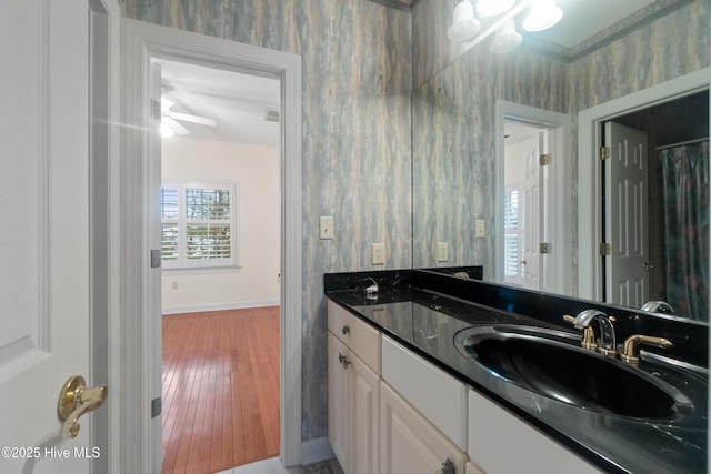 bathroom with vanity and wood-type flooring