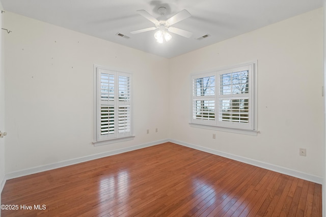 unfurnished room featuring hardwood / wood-style floors and ceiling fan