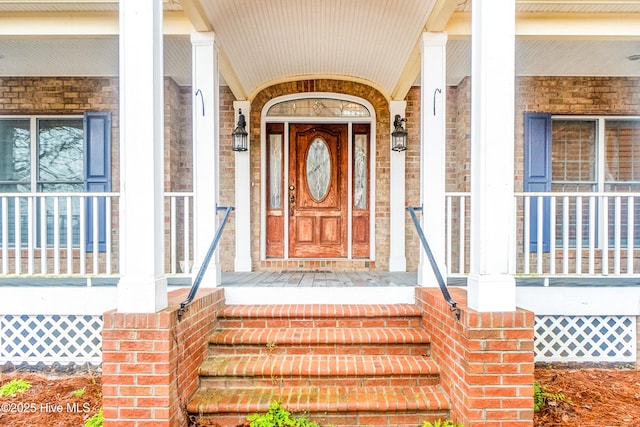 property entrance with covered porch