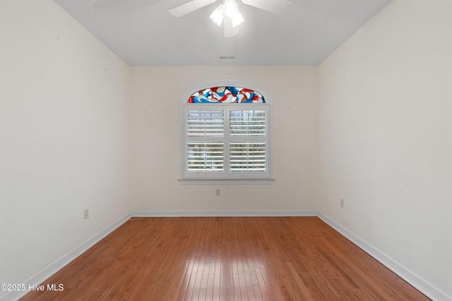 spare room featuring ceiling fan and wood-type flooring