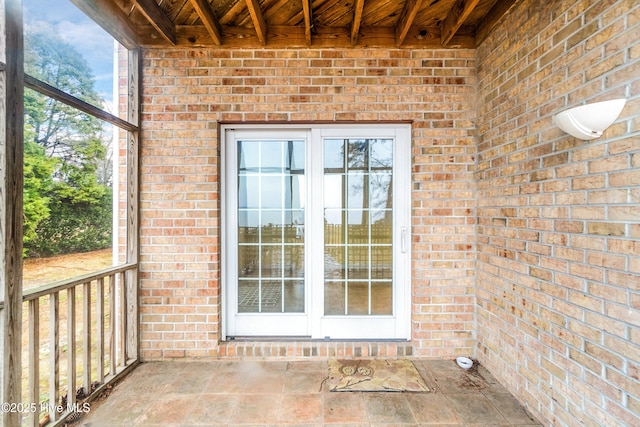 view of exterior entry featuring french doors