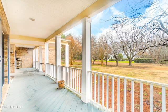 wooden terrace with a porch