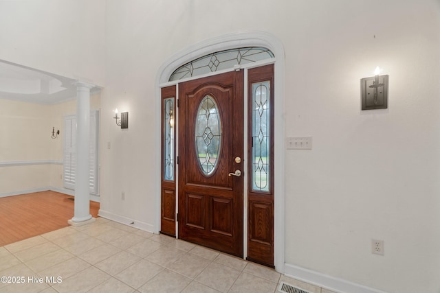 tiled entryway with decorative columns