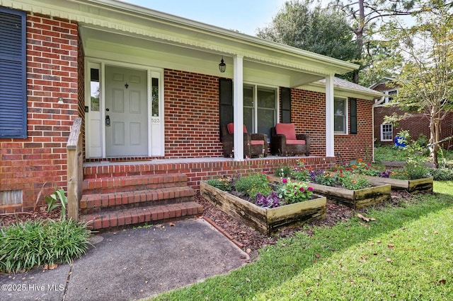 entrance to property featuring covered porch