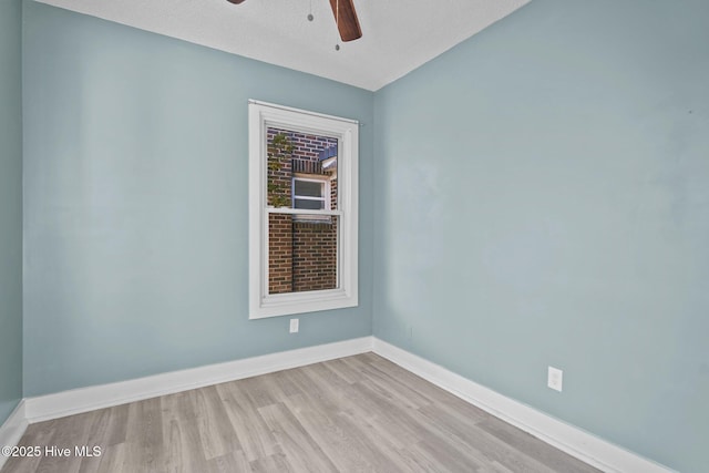 unfurnished room featuring light wood-type flooring, a textured ceiling, and ceiling fan