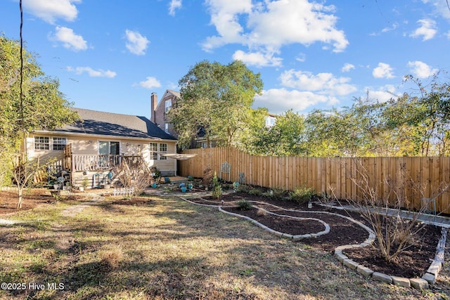 view of yard featuring a wooden deck