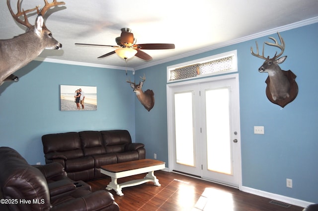 living room featuring crown molding, dark hardwood / wood-style flooring, and ceiling fan