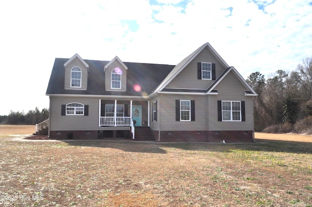 view of front of house with a porch and a front lawn