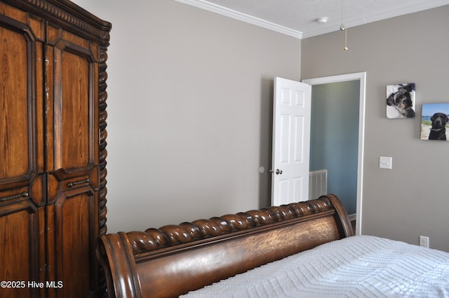 bedroom featuring crown molding