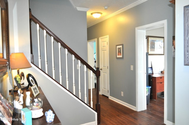 staircase with wood-type flooring and crown molding