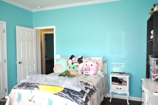 bedroom with dark wood-type flooring and crown molding