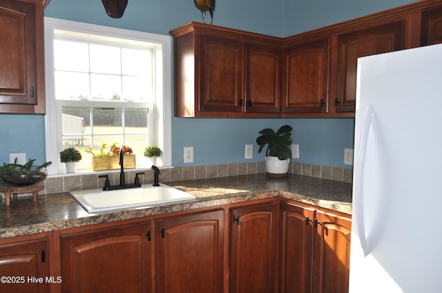 kitchen with white refrigerator and sink