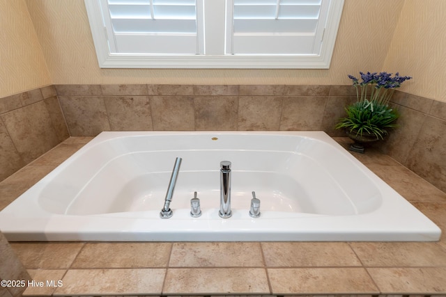 full bathroom featuring a bath and wallpapered walls