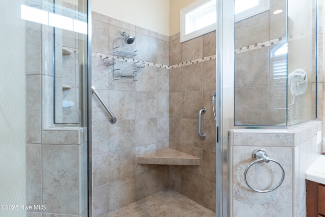 bathroom with a shower stall