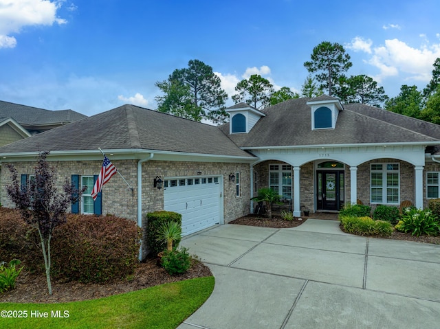 view of front of house featuring a porch and a garage