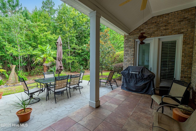 view of patio / terrace featuring ceiling fan, outdoor dining space, and a grill