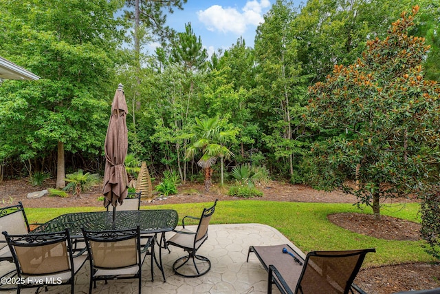 view of patio / terrace featuring outdoor dining area and stairway