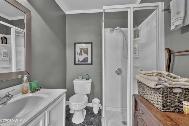 bathroom with toilet, vanity, baseboards, a shower stall, and crown molding